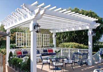 outdoor-dining-area-in-white-pergola-feat-vintage-dining-table-sets